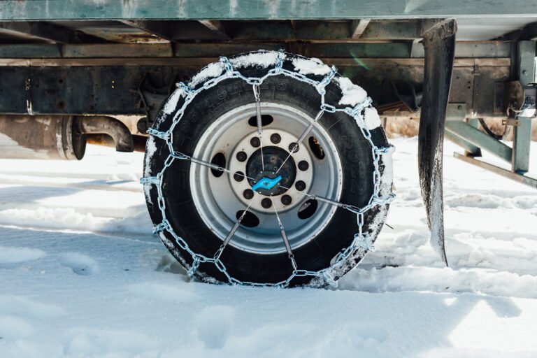 Semi trailer tire chained up with The Kranken XL